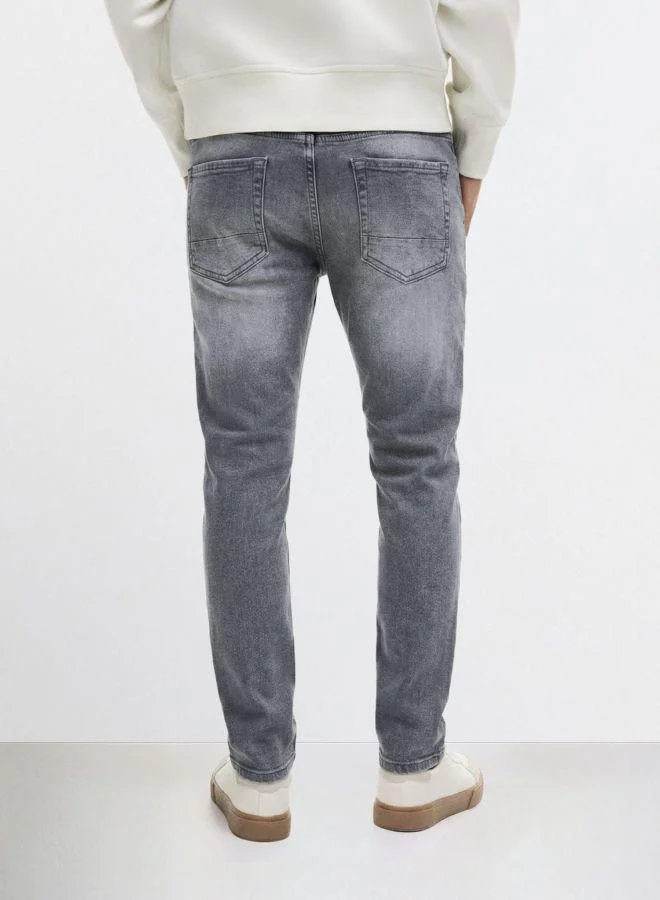The Indian Garage Co Men Slim Fit Solid Scoop Pocket Mid-Rise Jeans